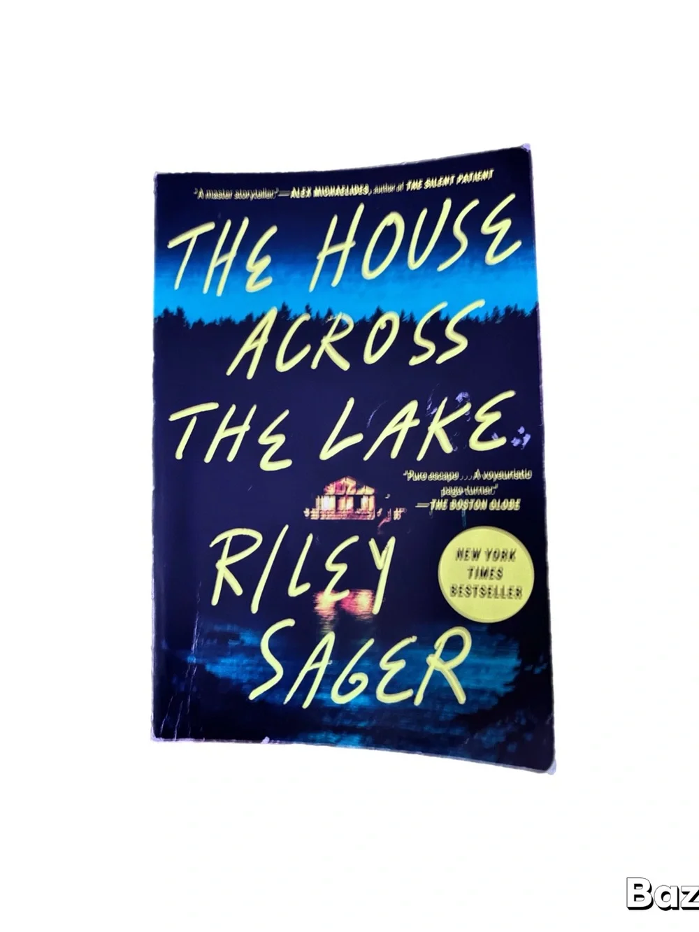 The House Across The Lake by Riley Sager - Navy Blue & Yellow Paperback